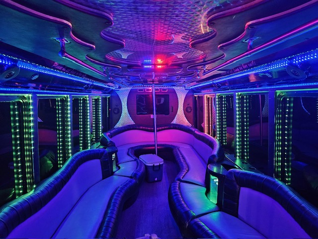 Galaxy 12 party bus interior with cosmic ceiling lights and multi-color LED party zones